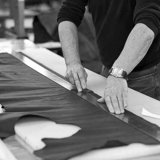 Canvas being cut. The Original Peter manufacturing process in action, showing one of our Original Peter Record Hunting Bags being hand made by Brady Bags in Walsall, England to the highest specification with the highest quality materials.