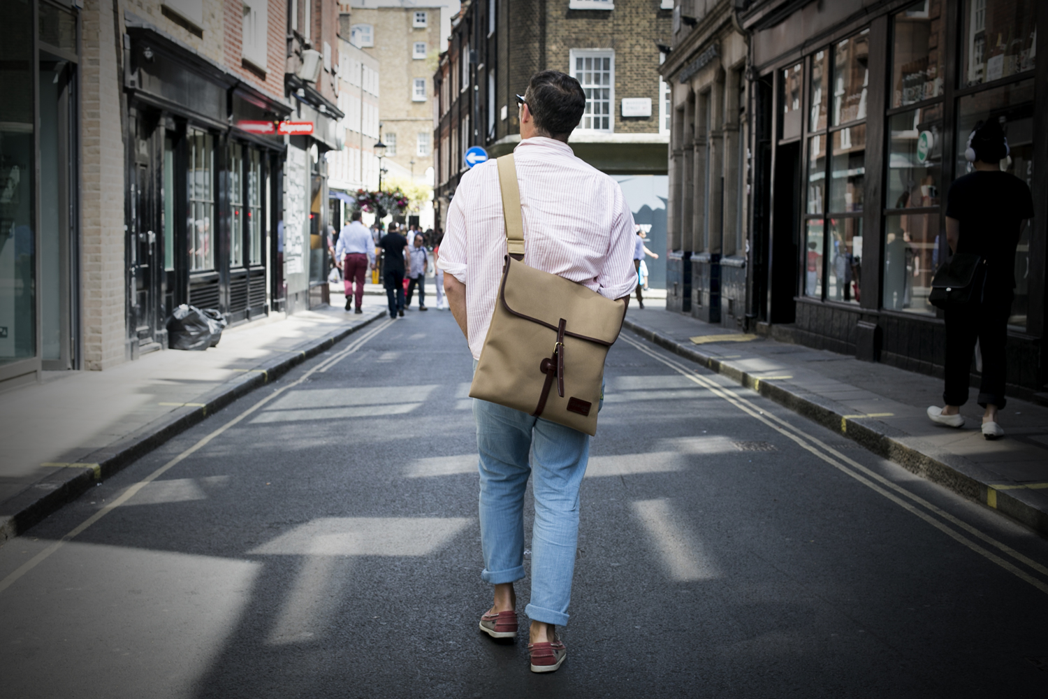 Jonny Trunk wearing the Original Peter Classic 12-inch LP Record Hunting Bag in Khaki while record hunting in Soho, London, England.